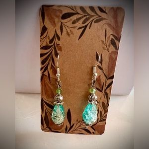 Handcrafted crackle glass teardrop earrings on sterling silver hooks.